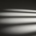 Blurred light and shadow pattern with elongated streaks across a dark background. Th Royalty Free Stock Photo