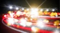 Blurred light trails from moving vehicles create dynamic patterns on dark road Royalty Free Stock Photo