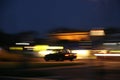 Blurred lights and car