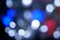 Blurred lights dark blue, white, red background. Abstract bokeh with soft light. Shiny festive christmas texture Royalty Free Stock Photo