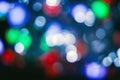 Blurred lights dark blue, white, red, pink, green background. Abstract bokeh with soft light. Shiny festive christmas texture Royalty Free Stock Photo