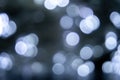 Blurred lights dark gray, blue background. Abstract bokeh with soft light. Shiny festive texture Royalty Free Stock Photo