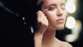 blurred makeup artist applying dark liquid Royalty Free Stock Photo