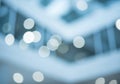 Blurred modern building interior with glowing ceiling lights abstract background Royalty Free Stock Photo