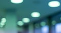 Blurred modern building interior with glowing ceiling lights abstract background Royalty Free Stock Photo