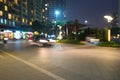 Blurred modern urban city at night with street traffic Royalty Free Stock Photo