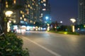 Blurred modern urban city at night with street traffic Royalty Free Stock Photo