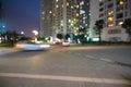 Blurred modern urban city at night with street traffic Royalty Free Stock Photo