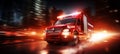 Blurred motion of ambulance with flashing lights responding to emergency situation on the road