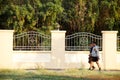 Asian thai people running jogging and exercise in dusk time at public garden park in Nonthaburi, Thailand.