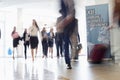 Blurred motion of business people walking in convention center Royalty Free Stock Photo