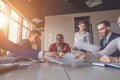 Blurred motion businesspeople working with boss sitting in background at office Royalty Free Stock Photo