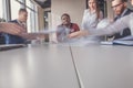 Blurred motion businesspeople working with boss sitting in background at office Royalty Free Stock Photo