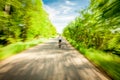 Blurred motion of cycling woman