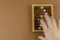 Blurred motion of the hand counting on wooden abacus Royalty Free Stock Photo