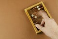 Blurred motion of the hand counting on wooden abacus Royalty Free Stock Photo