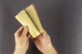 Blurred Motion Of Hand Turning Page Over gray Background Royalty Free Stock Photo