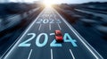 highway with red car, and new year number 2024, 2023 on the road Royalty Free Stock Photo