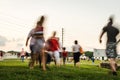 Blurred Motion of People Walking To An Outdoor Concert