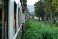 Blurred motion picture of female traveller records clip during train trip in Thailand