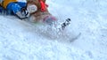 Children sliding on snowy mountain