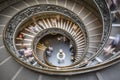 Blurred motion of tourists descending the Bramante staircase ins