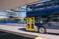 Blurred moving bus at park and ride transport station on North S