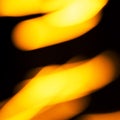 Blurred moving fire lights background, yellow, orange and white colors on black, abstract template for design, high resolution Royalty Free Stock Photo