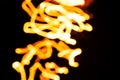 Blurred moving fire lights background, yellow, orange and white colors on black, abstract template for design, high resolution Royalty Free Stock Photo