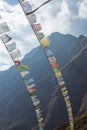 Blurred nature mountain background. Prayer buddhist flags fluttering in the wind. Nepal, Himalaya Royalty Free Stock Photo