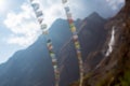 Blurred nature mountain background. Prayer buddhist flags fluttering in the wind. Nepal, Himalaya Royalty Free Stock Photo