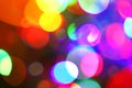 Blurred neon disco light dots pattern. Multi-coloured spotty background for design