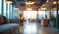 Blurred office interior background with warm lights, bokeh. Defocused corporate workspace with modern design, open plan layout. Royalty Free Stock Photo