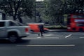 Blurred old homeless beggar men walking in the middle of the road at rush hour in London Royalty Free Stock Photo