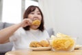 Blurred Overweight Asian Woman Enjoy Eatting Fried Drumstick Chicken