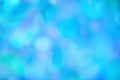 Blurred pastel neon blue mint pink holographic bokeh background texture Royalty Free Stock Photo