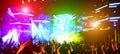 Blurred people dancing and having fun in summer festival party outdoor - Crowd with hands up celebrating fest concert event - Royalty Free Stock Photo