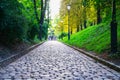 Blurred people in distance at end of path up hill to Vysehrad Fort Prague. Royalty Free Stock Photo