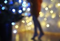 Blurred photo of cute little girl decorates christmas tree. Royalty Free Stock Photo