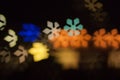 Blurred photo of defocused bokeh colorful lights in the shape of snowflake Royalty Free Stock Photo