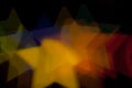 Blurred photo of defocused bokeh colorful lights in the shape of star Royalty Free Stock Photo