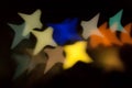 Blurred photo of defocused bokeh colorful lights in the shape of star Royalty Free Stock Photo