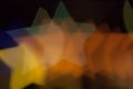 Blurred photo of defocused bokeh colorful lights in the shape of star Royalty Free Stock Photo