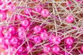 Blurred photo of sewing pins pile and reflection. Royalty Free Stock Photo