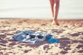 Blurred photo with shallow depth of field. Vacation holidays concept - silhouette of sun-tanned woman legs shoeless that walks Royalty Free Stock Photo