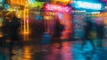 A blurred photograph capturing the hustle and bustle of people walking past a row of colorful storefronts each adorned Royalty Free Stock Photo