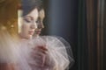 Blurred picture of charming tender bride in pink dress