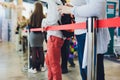 Blurred picture of Long Passenger Queue Waiting for Check-in at Airport Check-in Counters. Royalty Free Stock Photo