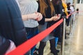 Blurred picture of Long Passenger Queue Waiting for Check-in at Airport Check-in Counters.