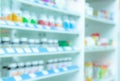 Blurred picture of medicine shelf in drug store. Pharmacy shop interiors. Pharmaceutical products in drugstore. Medical retail